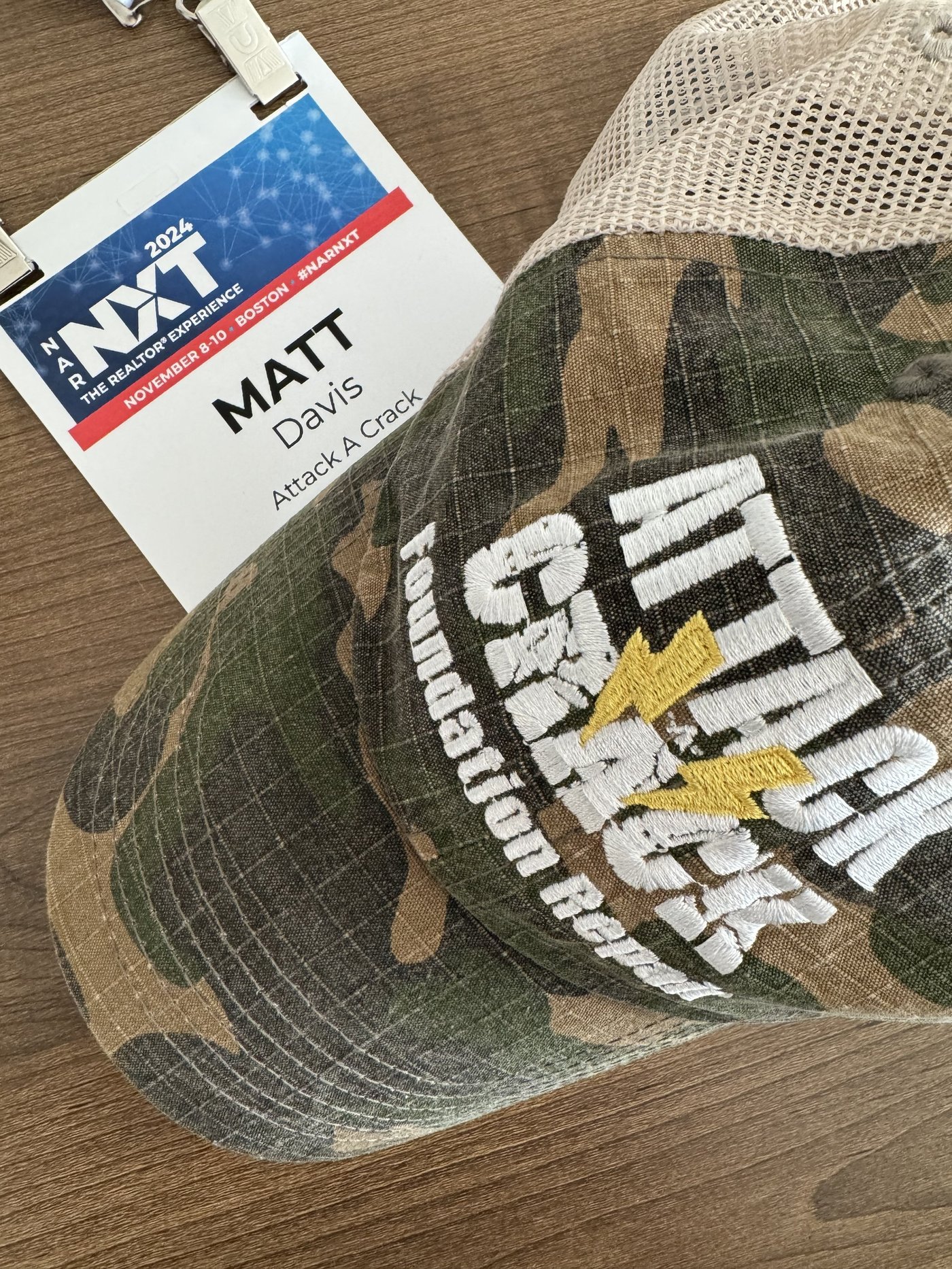 NAR NXT 2024 conference badge with Attack A Crack hat