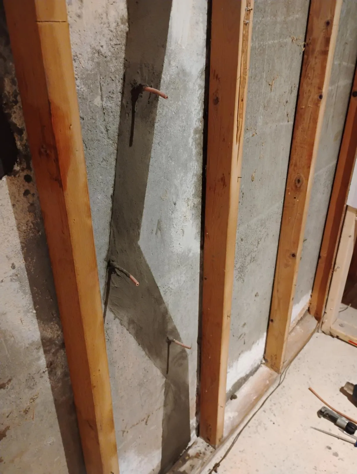 Crack injection repair in progress on Shrewsbury basement foundation